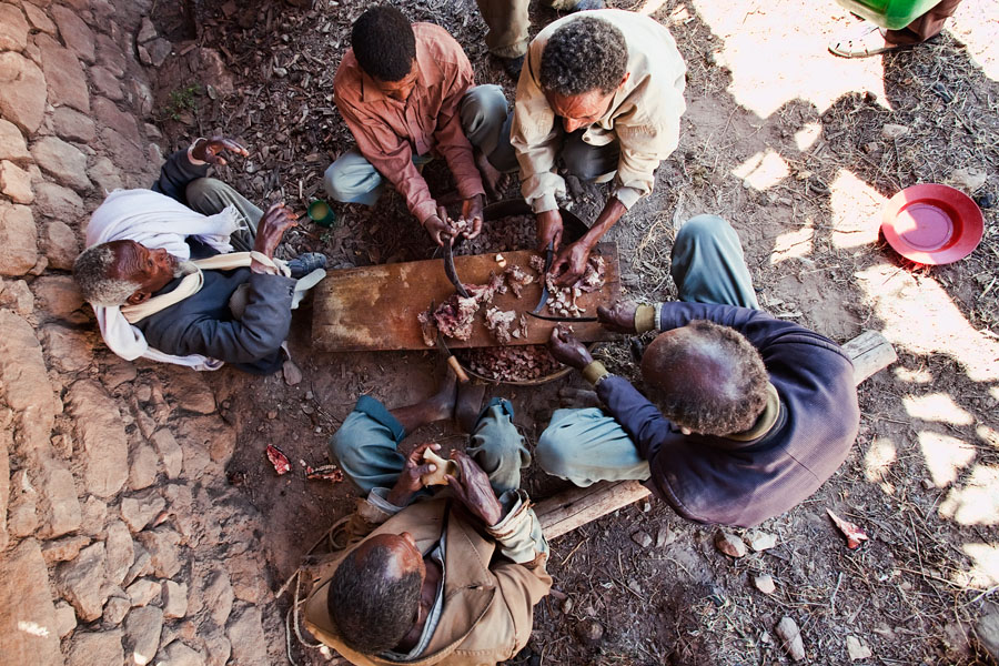103   A cow is slaughtered and prepared for a local orthodox celebration (near Yohannes Maequddi Rock hewn church)  Ethiopia 